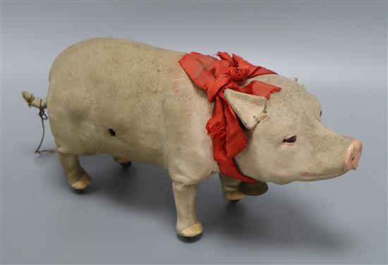 A clockwork squealing pig length 31cm